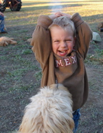 labradoodle puppy and boy