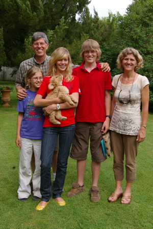 Labradoodle puppy and entire family