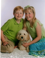 Labradoodle with boy and girl